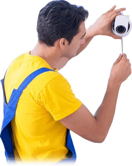 Technician installing dome camera to meet MOI-SSD security service standards.