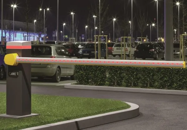 Automated gate barrier system at a parking entry in Qatar with LED boom and secure vehicle access.