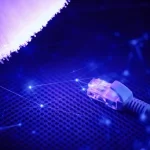 Structured cabling with Ethernet connector and glowing fiber optic strands.