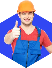 Smiling worker wearing orange helmet and blue uniform giving a thumbs up on a blue background